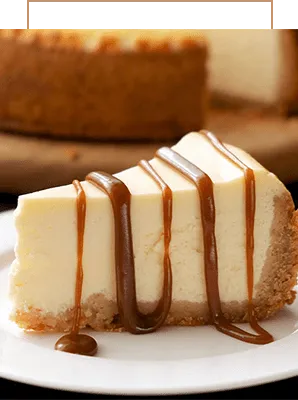 Slice of cheesecake with caramel drizzle